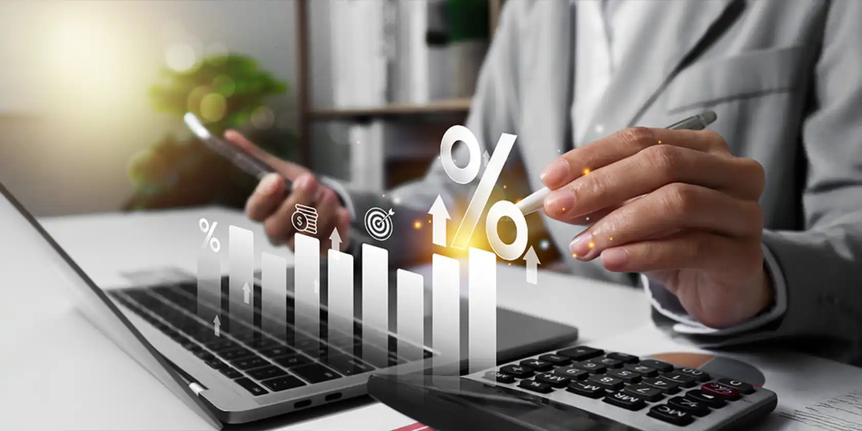 Pessoa analisando gráficos e números financeiros em um laptop, com foco em crescimento financeiro e tendências de mercado, ideal para conteúdo de finanças.